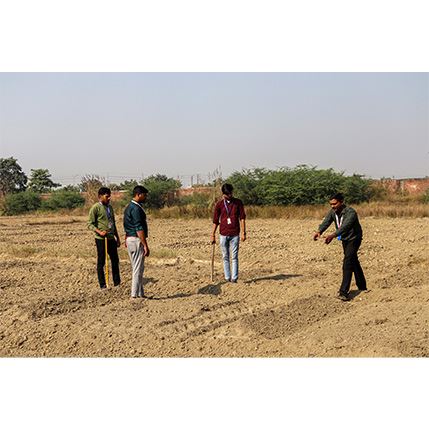 students working for wheat sowing