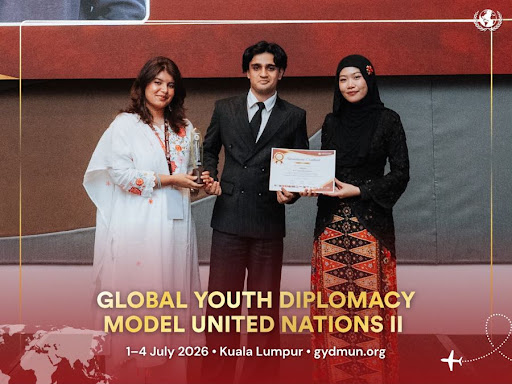 Amaan Lone holding trophy at GYDMUN Malaysia